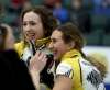 Mackenzie Zacharias, left, and Emily Zacharias celebrate winning the Canadian Junior Curling Championships last January. (TREVOR HAGAN / WINNIPEG FREE PRESS FILES)