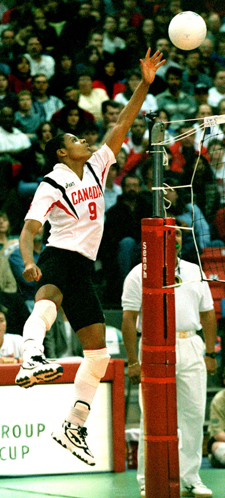 Wayne Glowacki / Winnipeg Free Press Files
Team Canada's Janis Kelly tips the ball over the net during the Continental Cup final against the Dominican Republic women's national volleyball team in Winnipeg in a 1996 Summer Olympics qualifying match.