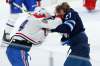 Winnipeg Jets' Nikolaj Ehlers and Montreal Canadiens' Corey Perry fight during the third period in Winnipeg on Thursday. THE CANADIAN PRESS/John Woods