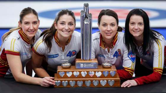 Team Canada, left to right, lead Briane Meilleur, second Shannon Birchard, third Val Sweeting and skip Kerri Einarson celebrates pose with the trophy after defeating Team Ontario. (Jeff McIntosh / The Canadian Press)
