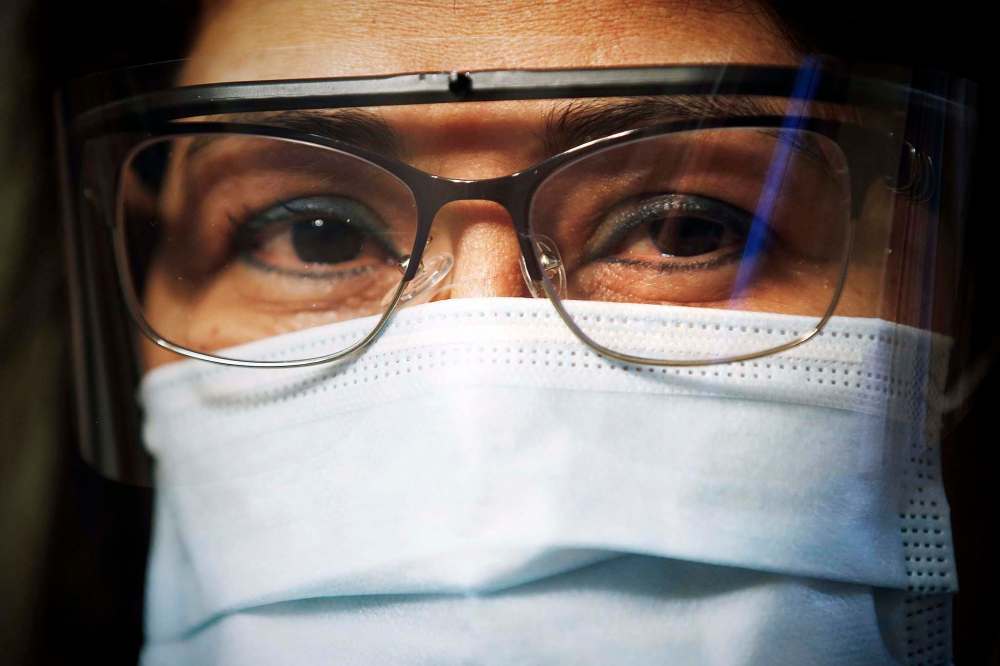 Mely Dela Cruz, a home care aide, takes precautions and wears proper PPE while she works. (John Woods / Winnipeg Free Press)