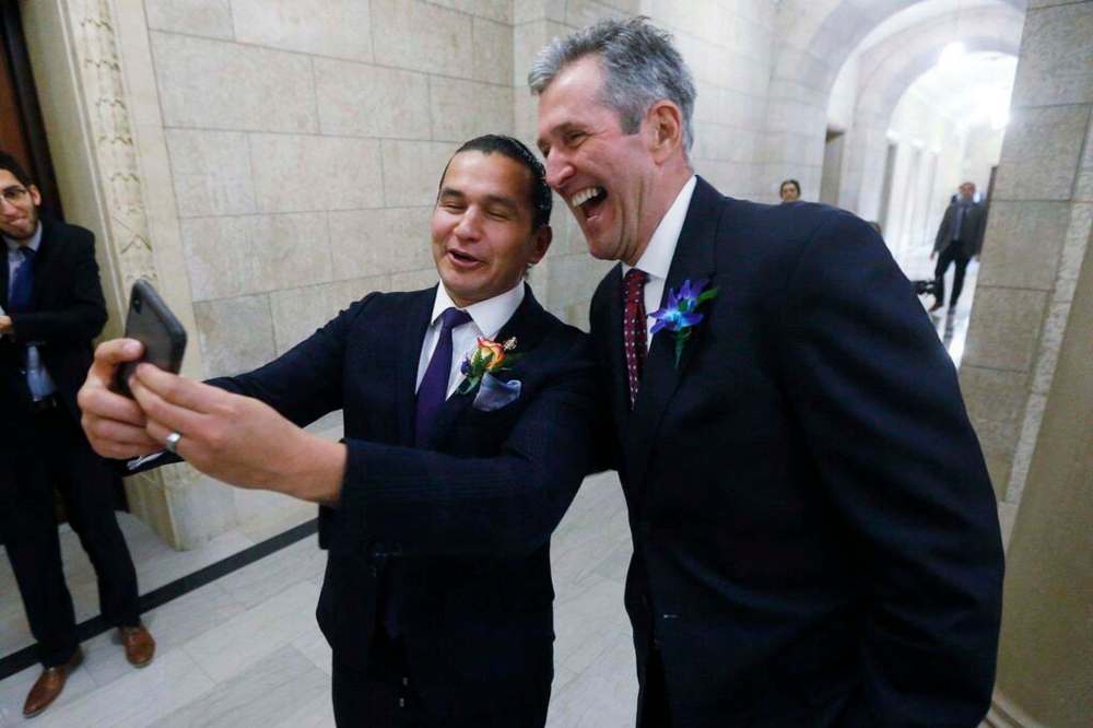 Manitoba Premier Brian Pallister, right, and Manitoba NDP Leader Wab Kinew pose for a selfie after the reading of the throne speech at the Manitoba Legislature in 2018. THE CANADIAN PRESS FILES/John Woods
