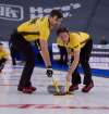 Matt Wozniak (left) and Adam Casey brush during Saturday&rsquo;s win over Alberta. (Michael Burns photo)