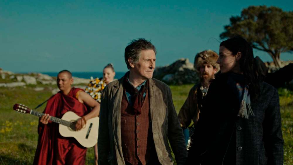Mongrel Media photo
In Ireland, Samuel O'Shea (Gabriel Byrne, right) and a storekeeper (Jessica Paré) are attended by an eccentric chorus in O'Shea's mind in Death of a Ladies' Man.