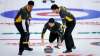 Jeff McIntosh / The Canadian Press
Team Wild Card 1 skip Mike McEwen watches his rock as lead Colin Hodgson (right) and second Derek Samagalski prepare to sweep against Team Alberta.
