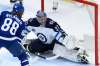 Winnipeg Jets goaltender Connor Hellebuyck (37) stops Toronto Maple Leafs centre William Nylander (88) during second period NHL action in Toronto on Thursday, March 11, 2021. THE CANADIAN PRESS/Frank Gunn