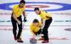 Team Manitoba skip Jason Gunnlaugson, centre, makes a shot as lead Connor Njegovan, right, and second Matt Wozniak look on while they plays Team Wild Card Two at the Brier in Calgary, Alta., Saturday, March 13, 2021.(Jeff McIntosh / The Canadian Press)
