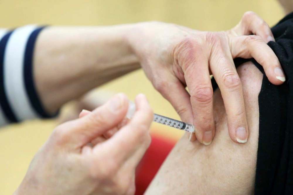 A vaccine is given at the COVID-19 vaccination super site in Winnipeg. Public opinion research conducted by the province suggests about 63 per cent of the population is eager to be vaccinated against the disease while another 12 per cent is likely to be vaccinated, but not in a rush to sign up for a shot. THE CANADIAN PRESS/Kevin King