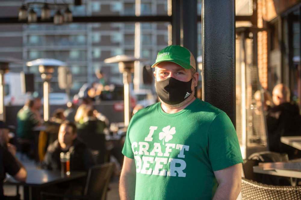 MIKE SUDOMA / WINNIPEG FREE PRESS
Jay Kilgour, owner of Fionn’s Grant Park, is happy to see people out on the patio, enjoying their St Patricks Day.