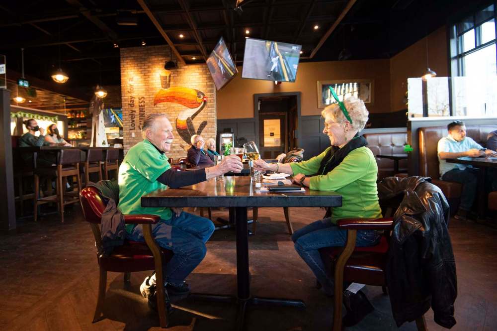 MIKE SUDOMA / WINNIPEG FREE PRESS
Don and Ethel McCully enjoy some time away from home as they celebrate St. Patrick's Day together at Fionn MacCool’s on Grant Avenue Wednesday.