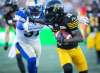 Hamilton Tiger-Cats wide receiver Brandon Banks tries to fend off a Winnipeg Blue Bombers defender. The CFL has submitted their return to play protocols to the provincial governments and is expecting a response in the coming weeks. THE CANADIAN PRESS FILES/Peter Power