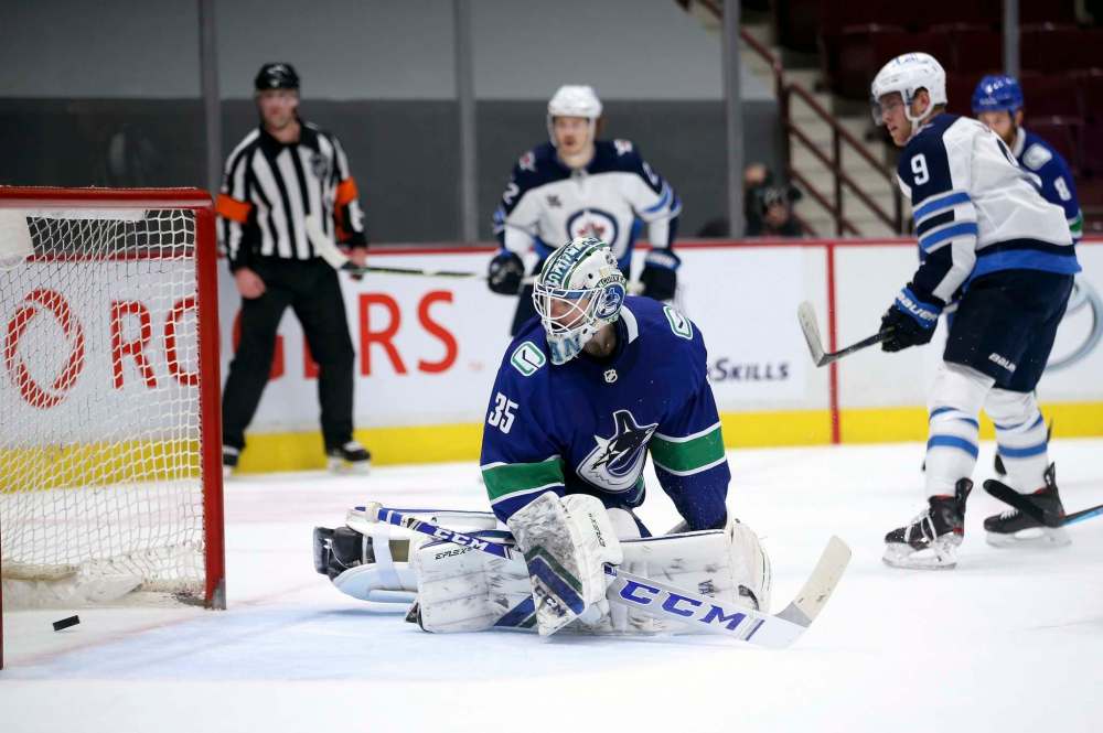 Winnipeg Jets' Andrew Copp scores his fourth goal of the game on Vancouver Canucks’ goaltender Thatcher Demko Wednesday. (TREVOR HAGAN / WINNIPEG FREE PRESS)