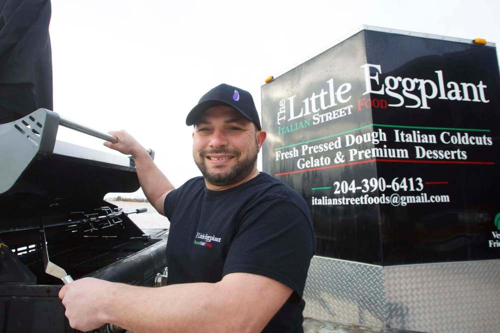 Fil Romolo, owner of Little Eggplant food truck is taking his truck out of storage early. Food trucks are scrambling to set up shop early as the weather gets warm. (Mike Deal / Winnipeg Free Press)