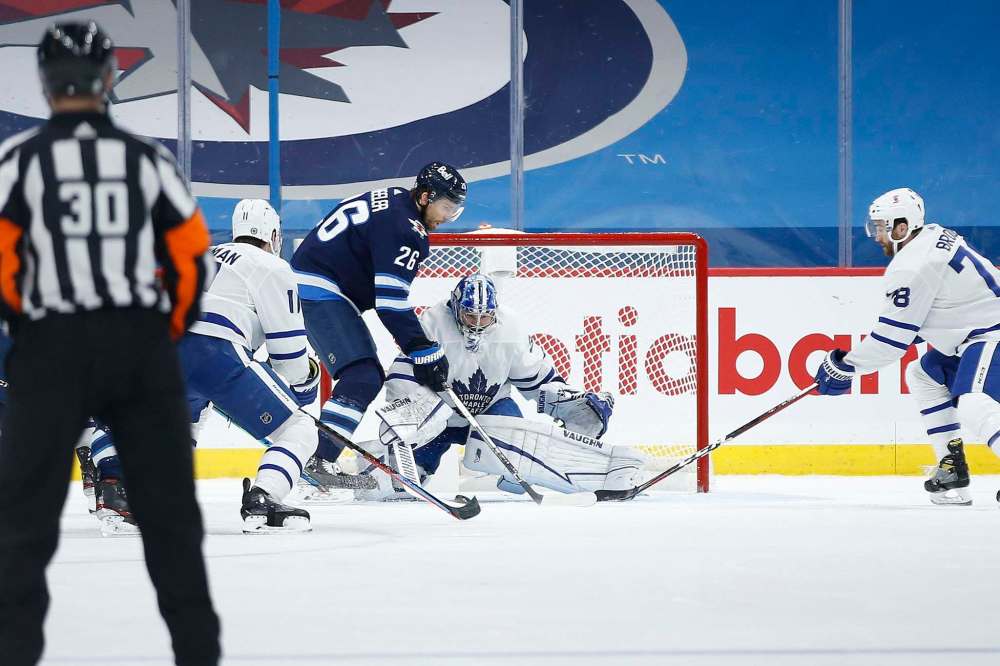 Blake Wheeler was back on the ice Friday despite leaving Wednesday's game early with an undisclosed injury. (John Woods / The Canadian Press)