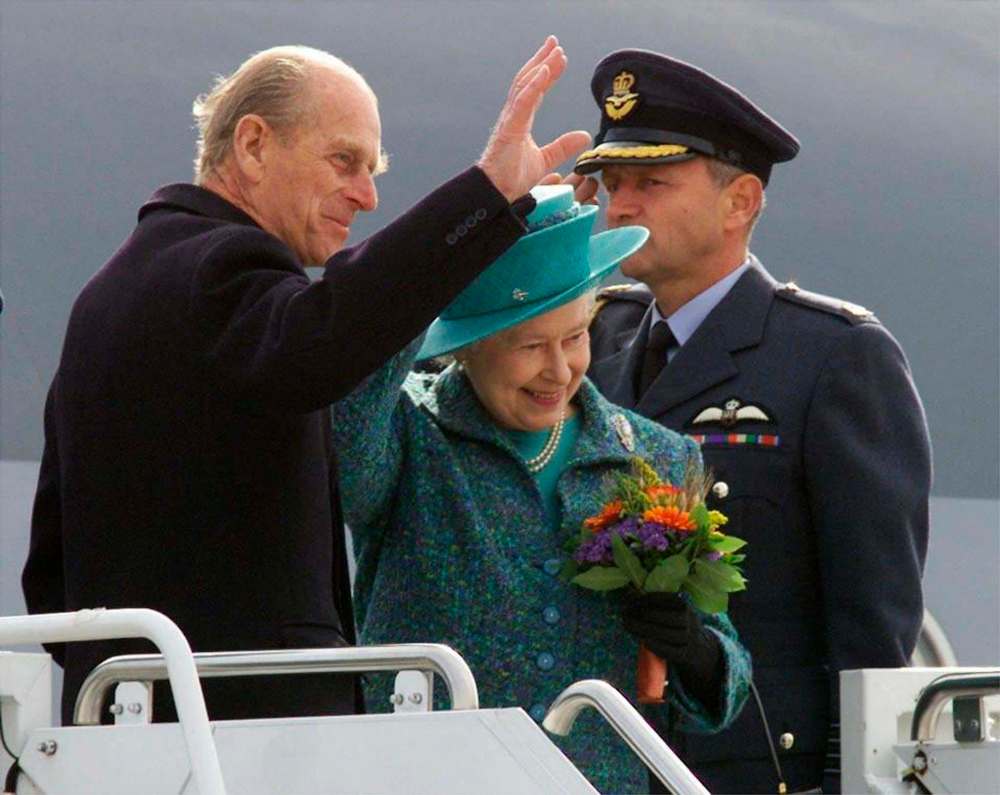 The Queen and Prince Philip wave as they depart Winnipeg on Oct. 9, 2002. Prince Philip, the Queen's husband of more than 70 years, passed away at Windsor Castle on Friday, Buckingham Palace announced. (Adrian Wyld / The Canadian Press files)