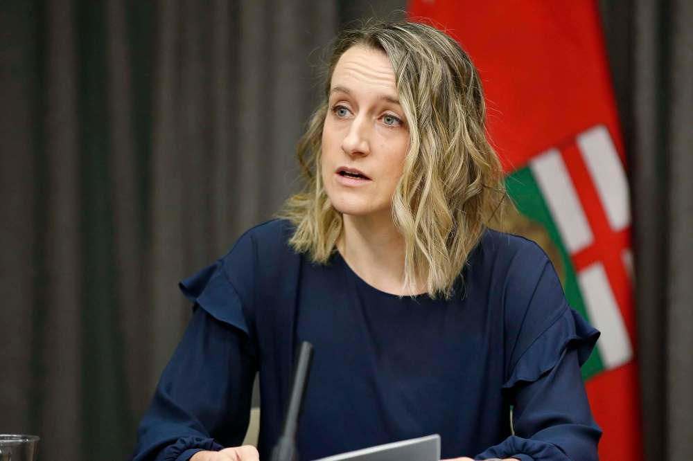 Dr. Joss Reimer, medical lead of Manitoba's Vaccine Implementation Task Force, said while they know front-line police officers and firefighters will now be included in the vaccine rollout, they will need a few more days to figure out who else will get it and where. (John Woods / The Canadian Press files)