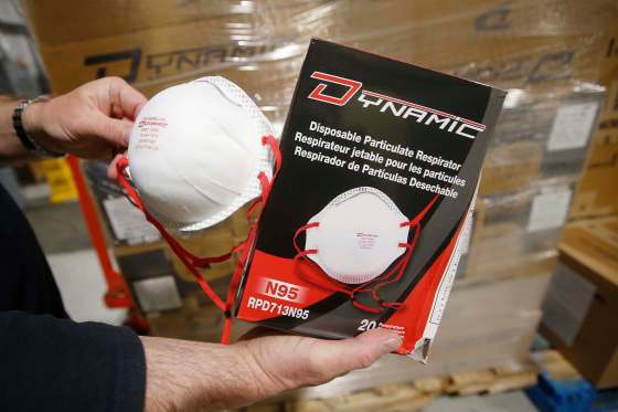 JOHN WOODS / WINNIPEG FREE PRESSMarty Harasymchuk, maintenance and custodial co-ordinator for the Seven Oaks School Division, shows the new N95 masks.