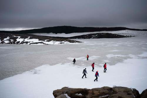 Felipe Dana / The Associated Press files
People walk on snow atop the Ok volcano crater on their way to a ceremony by the area which once was the Okjokull glacier in Iceland. Author Andri Snær Magnason&rsquo;s latest combines Icelandic folklore, cultural histories and science-driven extrapolations to send a strong message about the planetary damage humans are causing.