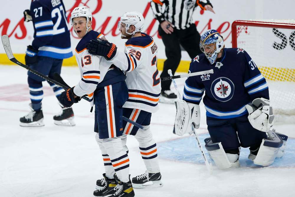The Edmonton Oilers were the only team on the ice with any energy Saturday night. Jesse Puljujarvi (left) and Leon Draisaitl celebrate Puljujarvi’s third-period goal. (John Woods / The Canadian Press files)