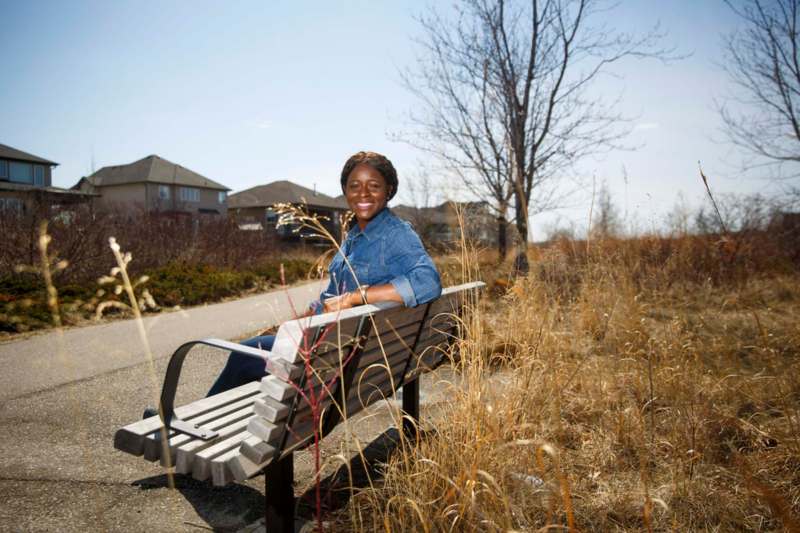 photos by MIKE DEAL / WINNIPEG FREE PRESS
Alero Tenumah relaxes in Ken Oblik Greenway Park. Each poet was asked to choose a location, inside or outside, that was their refuge during the pandemic.