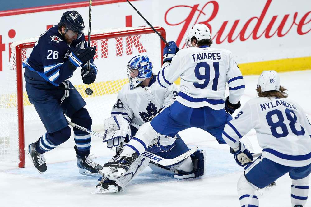 John Woods / The Canadian Press
Winnipeg Jets Captain Blake Wheeler's (left) return to the lineup was tempered by an injury to Adam Lowry and a loss to the Toronto Maple Leafs.