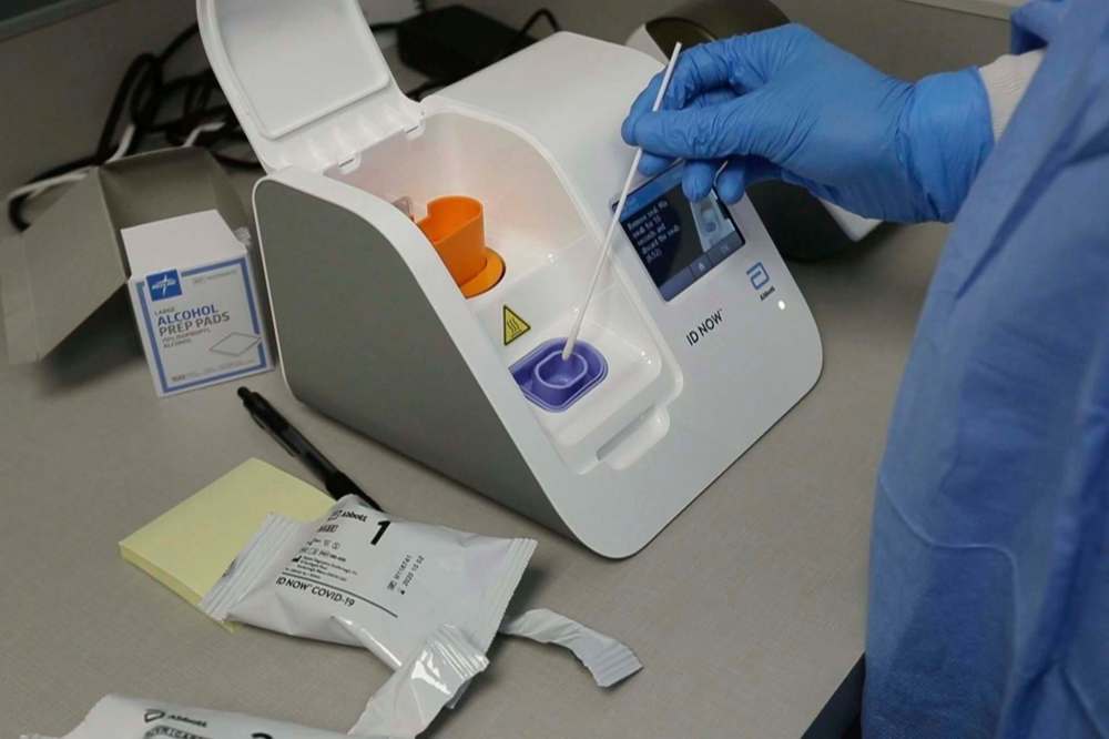 Rapid tests are used to detect the coronavirus in as little as 15 minutes, but they’re nowhere near as sensitive as the regular PCR tests that are mostly done in large laboratories. (Carlos Osorio / The Associated Press files)