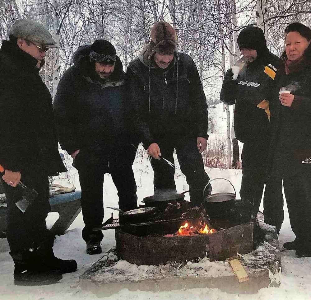NIIGAAN SINCLAIR / WINNIPEG FREE PRESS
The camp's breakfast includes eggs, bacon, beans and coffee – all cooked over an open fire, outdoors in -30C temperatures.