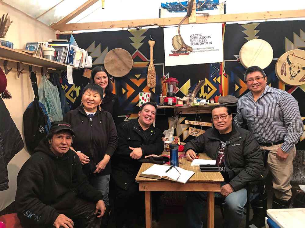 SUPPLIED
Niigaan Sinclair, centre, with elders and counsellors at the Arctic Indigenous Wellness Foundation (AIWF) free breakfast in a traditional camp.