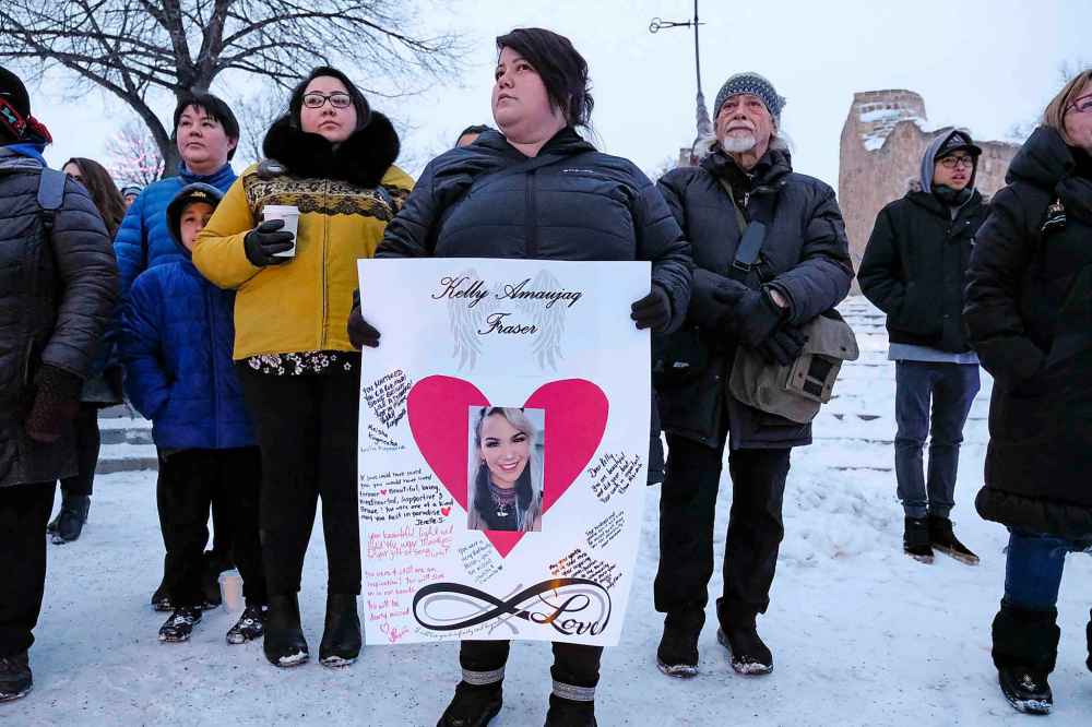 Daniel Crump / Winnipeg Free Press
A woman holds a sign memorializing Kelly Fraser during a a vigil in the singer's honour at the Odena Circle in Winnipeg last Saturday.