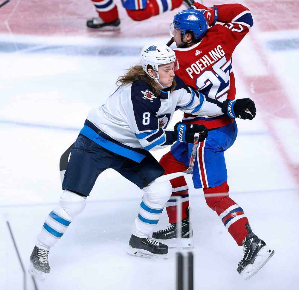 (TREVOR HAGAN / WINNIPEG FREE PRESS)
Winnipeg Jets' Sami Niku collides with Montreal Canadiens' Ryan Poehling during the first period.
