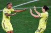 Nashville SC midfielder Randall Leal, left, is congratulated by Alex Muyl after scoring a goal during the first half of the team's MLS soccer match against the Montreal Impact, Tuesday, Oct. 27, 2020, in Harrison, N.J. (AP Photo/Adam Hunger)