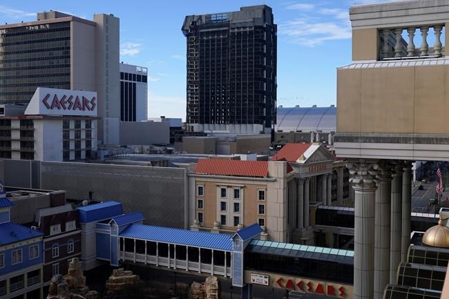 The former Trump Plaza casino is imploded on Wednesday, Feb. 17, 2021, in Atlantic City, N.J. After falling into disrepair, the one-time jewel of former President Donald Trump's casino empire is reduced to rubble, clearing the way for a prime development opportunity on the middle of the Boardwalk, where the Plaza used to market itself as