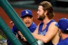 Los Angeles Dodgers manager Dave Roberts talks with starting pitcher Clayton Kershaw before Game 3 of a baseball National League Championship Series against the Atlanta Braves Wednesday, Oct. 14, 2020, in Arlington, Texas. (AP Photo/Tony Gutierrez)