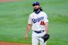 Los Angeles Dodgers starting pitcher Tony Gonsolin walks to the dugout after the top of the third inning against the Atlanta Braves in Game 2 of a baseball National League Championship Series Tuesday, Oct. 13, 2020, in Arlington, Texas. (AP Photo/Eric Gay)