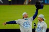 Los Angeles Dodgers manager Dave Roberts, left, and President of Baseball Operations Andrew Friedman celebrate with the trophy after winning Game 7 of a baseball National League Championship Series against the Atlanta Braves Sunday, Oct. 18, 2020, in Arlington, Texas. (AP Photo/Eric Gay)