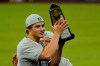 Los Angeles Dodgers shortstop Corey Seager celebrates with the MVP trophy after winning Game 7 of a baseball National League Championship Series against the Atlanta Braves Sunday, Oct. 18, 2020, in Arlington, Texas. (AP Photo/Eric Gay)