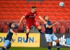 Toronto FC midfielder Liam Fraser (27) battles for the loose ball against Vancouver Whitecaps defender Ali Adnan (53) during second half MLS Canadian Championship soccer action in Toronto on Friday, August 21, 2020. THE CANADIAN PRESS/Nathan Denette