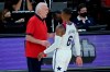United States head coach Gregg Popovich speaks with Damian Lillard (6) during the first half of an exhibition basketball game against Spain in preparation for the Olympics, Sunday, July 18, 2021, in Las Vegas. (AP Photo/John Locher)