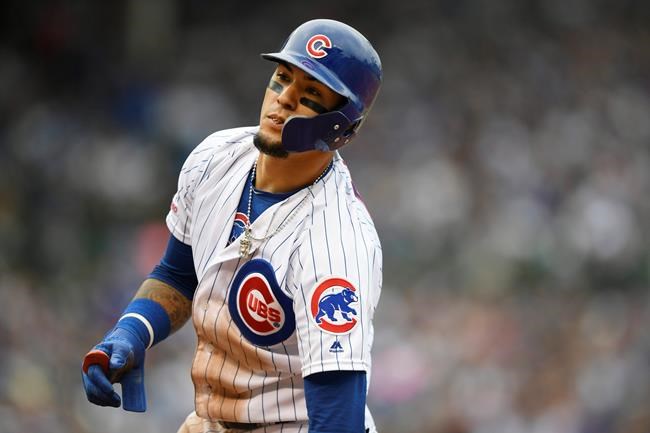 FILE - IN this Sept. 1, 2019 file photo, Chicago Cubs' Javier Baez reacts after being forced out at first base during the fifth inning of a baseball game against the Milwaukee Brewers in Chicago. Baez wants his Cubs to be better prepared this season. The two-time All-Star said Sunday, Feb. 16, 2020 at spring training that he and the Cubs were lacking last year when it came to their pregame routines and work ethic. (AP Photo/Paul Beaty, File)
