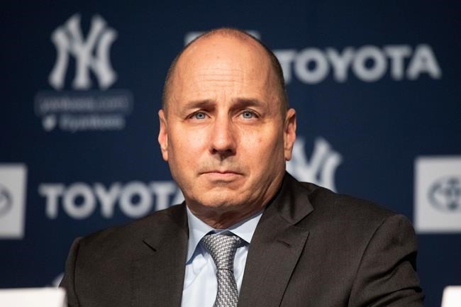 FILE - In this Dec. 18, 2019 file photo, New York Yankees general manager Brian Cashman attends a news conference in New York. Cashman had suspected that the Houston Astros had been breaking rules against electronic sign stealing long before Commissioner Rob Manfred released his report in January that resulted in three big league managers losing their jobs.