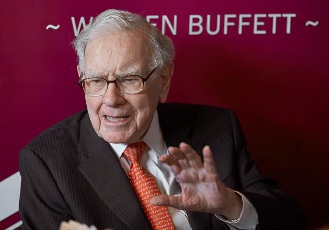 FILE - In this May 5, 2019, file photo Warren Buffett, Chairman and CEO of Berkshire Hathaway, speaks during a game of bridge following the annual Berkshire Hathaway shareholders meeting in Omaha, Neb. Buffett will release his annual letter to Berkshire Hathaway shareholders on Saturday, Feb. 22, 2020. Buffett's letter is always one of the most-read business reports every year. (AP Photo/Nati Harnik, File)