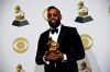 FILE - In this Sunday, Jan. 26, 2020 file photo, PJ Morton poses in the press room with the award for best R&B song for 