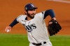 FILE - Tampa Bay Rays starting pitcher John Curtiss throws against the Los Angeles Dodgers during the fifth inning in Game 3 of the baseball World Series in Arlington, Texas, in this Friday, Oct. 23, 2020, file photo. Right-handed reliever John Curtiss was traded Wednesday, Feb. 17, 2021, by the Tampa Bay Rays to the Miami Marlins for minor league first baseman Evan Edwards. (AP Photo/Tony Gutierrez, File)