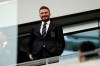 FILE - David Beckham looks on from the stands before an MLS soccer match between Los Angeles FC and Inter Miami CF in Los Angeles, in this Sunday, March 1, 2020, file photo. Inter Miami is hiring Phil Neville as its new coach, a move that reunites him with team owner David Beckham. They were teammates at Manchester United for more than a decade.(AP Photo/Marcio Jose Sanchez, File)