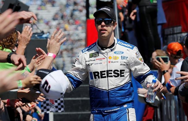 FILE - In this March 24, 2019 file photo, NASCAR Cup Series driver Brad Keselowski greets fans during driver introductions prior to the NASCAR Cup Series auto race at the Martinsville Speedway in Martinsville, Va. Keselowski didn’t get the finish he hoped for last weekend of April 4, 2021, when NASCAR’s Cup Series ran on the dirt at Bristol Motor Speedway, but the 2012 champion didn’t dwell too long on his 11th place finish. (AP Photo/Steve Helber, File)