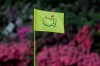 FILE - In this April 11, 2019, file photo, the flag on the 13th hole blows in the wind during the first round for the Masters golf tournament in Augusta, Ga. Augusta National decided Friday, March 13, 2020, to postpone the Masters because of the spread of the coronavirus. Club chairman Fred Ridley says he hopes postponing the event puts Augusta National in the best position to host the Masters and its other two events at some later date. Ridley did not say when it would be held.(AP Photo/David J. Phillip, Fil)