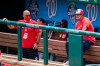 FILE - In this Sunday, Aug. 2, 2020, file photo, Washington Nationals manager Dave Martinez, right, with General Manager Mike Rizzo, left, watch from the dugout a baseball intrasquad game at Nationals Park in Washington. For the second season in a row, manager Dave Martinez’s Washington Nationals got off to a 19-31 start. This time, there were not enough games to dig themselves out of that hole. (AP Photo/Manuel Balce Ceneta, File)