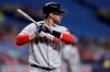 FILE - In this Sept. 23, 2019, file photo, Boston Red Sox's J.D. Martinez bats against the Tampa Bay Rays during the first inning of a baseball game in St. Petersburg, Fla. Many Red Sox players talked Saturday, Jan. 18, about how much they liked and valued manager Alex Cora and hated to see him go. “I’m heartbroken about it,