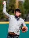 FILE - Black Keys drummer Patrick Carney throws out the ceremonial first pitch before a baseball game between the Boston Red Sox and the Cleveland Indians in Cleveland, in this Tuesday, April 5, 2016, file photo. The Indians are calling upon a pinch-drummer for their home opener. With long-time drummer John Adams recovering from heart surgery and unable to attend his first opener in Cleveland in 48 years, Black Keys drummer and life-long Indians fan Patrick Carney will fill and pound away from the left-field bleachers during Monday's, April 5, 2021, game against Detroit. (AP Photo/Tony Dejak, File)