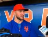 FILE - In this May 16, 2019 file photo, Syracuse Mets' Tim Tebow speaks with reporters prior to a minor league baseball game in Syracuse, N.Y. Tebow has been invited to big league spring training by the New York Mets, taking one of 75 spots after Major League Baseball limited spring roster sizes as a coronavirus precaution. (AP Photo/John Kekis, File)